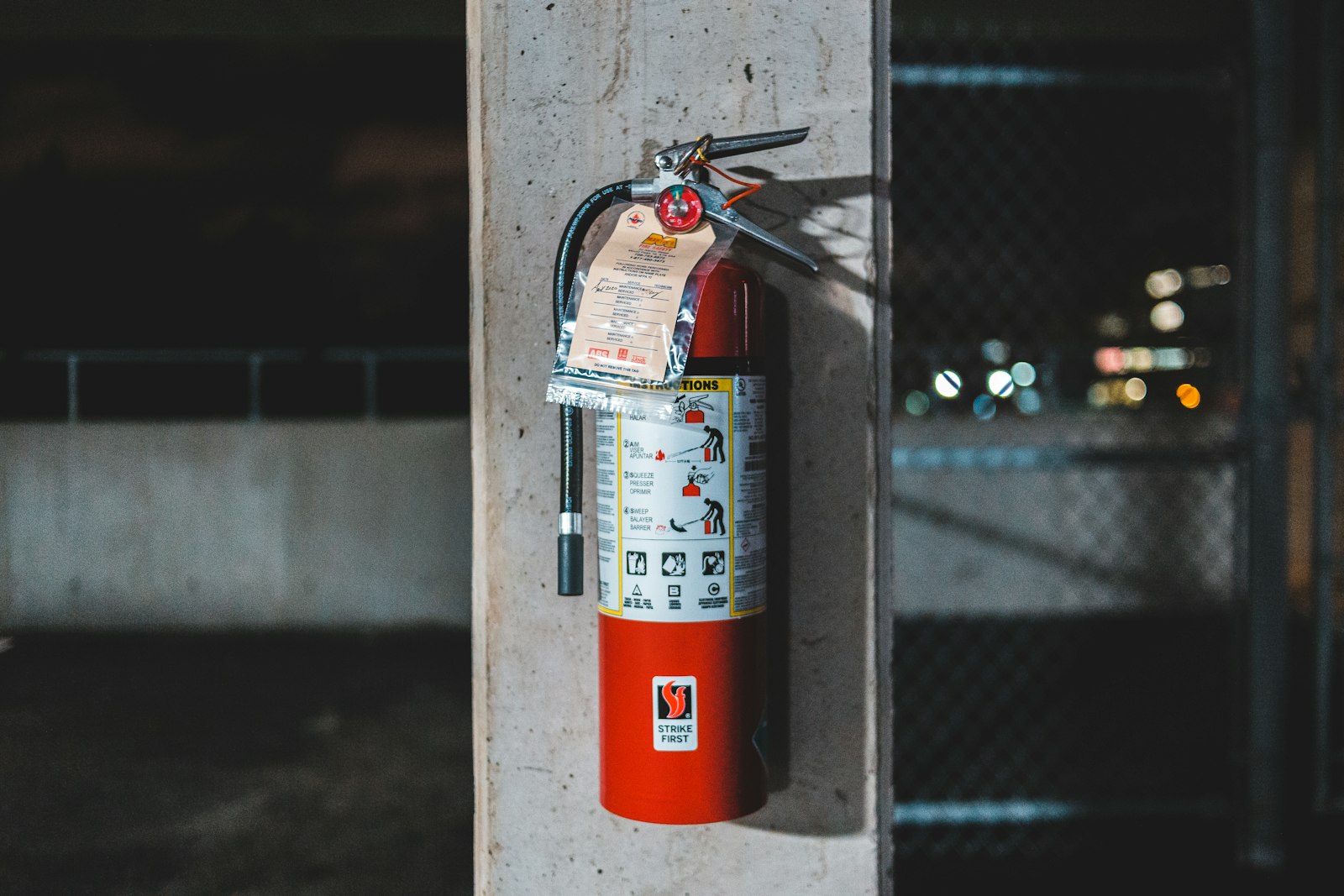 Fire extinguisher near a soot-stained wall in an Overland Park home