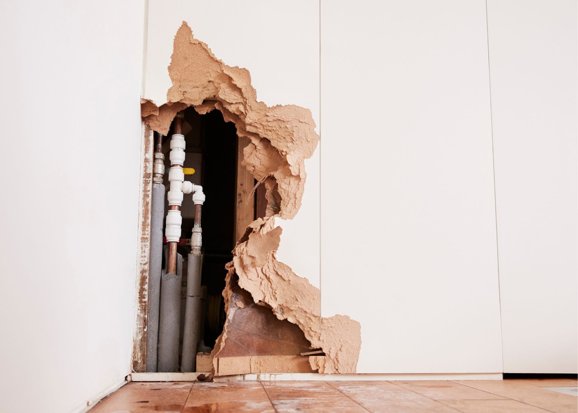 Wall opened to check for trapped moisture during structural drying in Overland Park